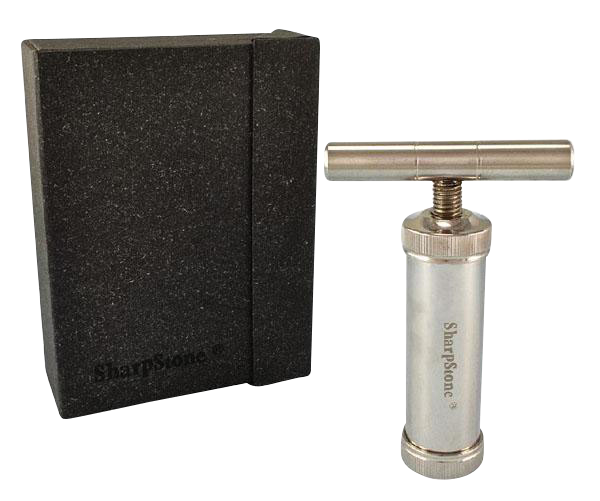 Studio-lit image of the Sharpstone T-Style Press with Case showing the stainless T-handle press beside its black foam storage case.