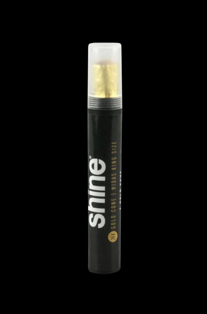 A close-up, angled view of the Shine 24K Gold Kingsize Pre-Rolled Cone, displaying a gold-toned paper roll.