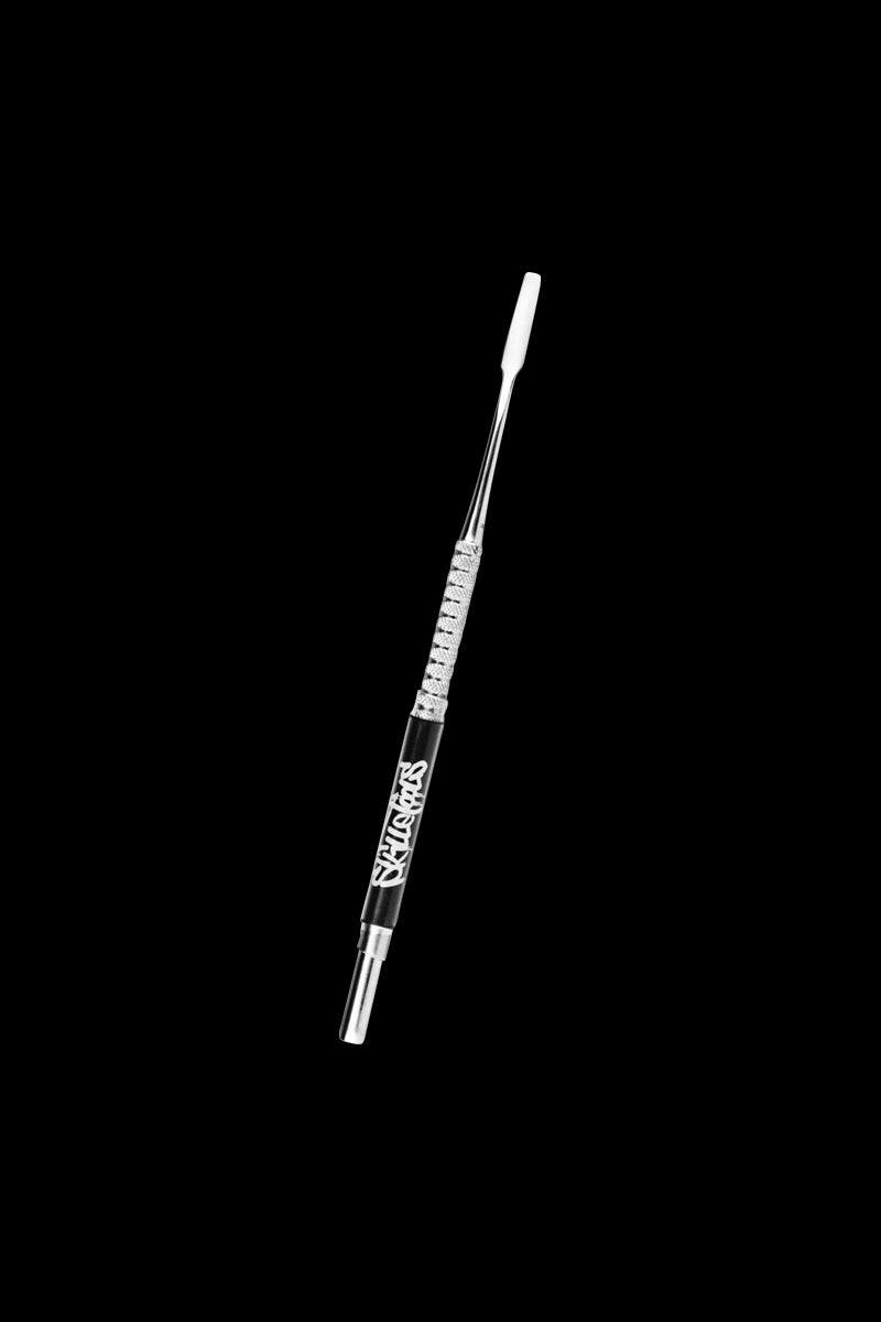 A close-up shot of the Skilletools Classic Series Metal Dab Tools, showing the angled metal tip against a dark background.