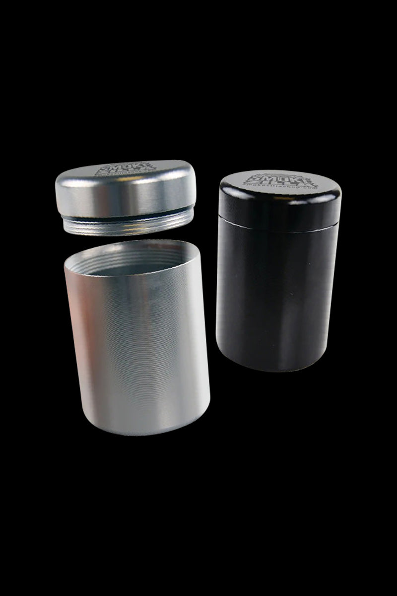 A front view of the Smokezilla Smell Proof Storage Jar - 4 Pack, showcasing a sleek, cylindrical container on a black background.
