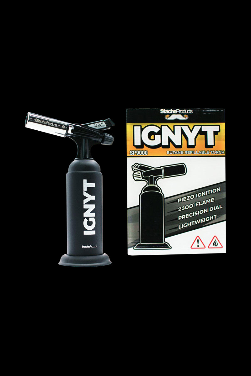 Front view of the Stache Products IGNYT Refillable Butane Torch with a black finish, displaying branding details on a white background.