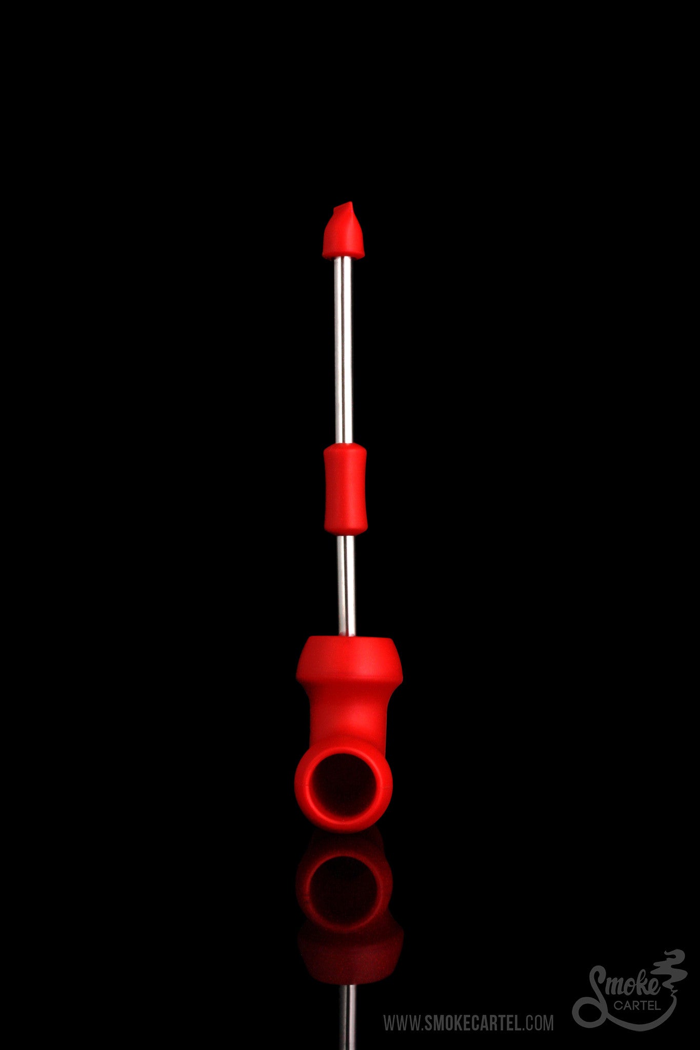 Red dab tool with spherical accents against a black background.