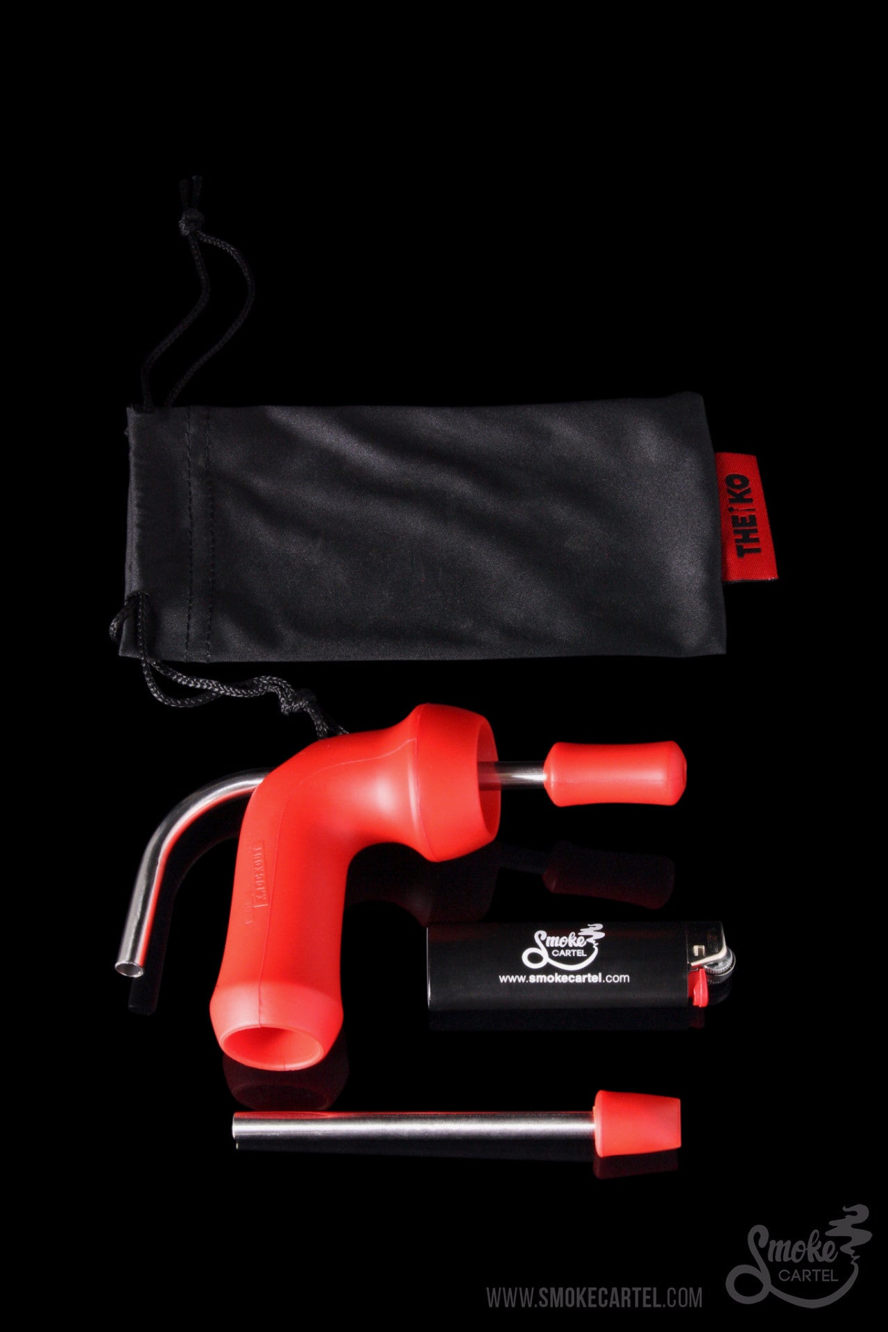 Red nectar collector with titanium tip, glass dish, and storage bag against a black background.
