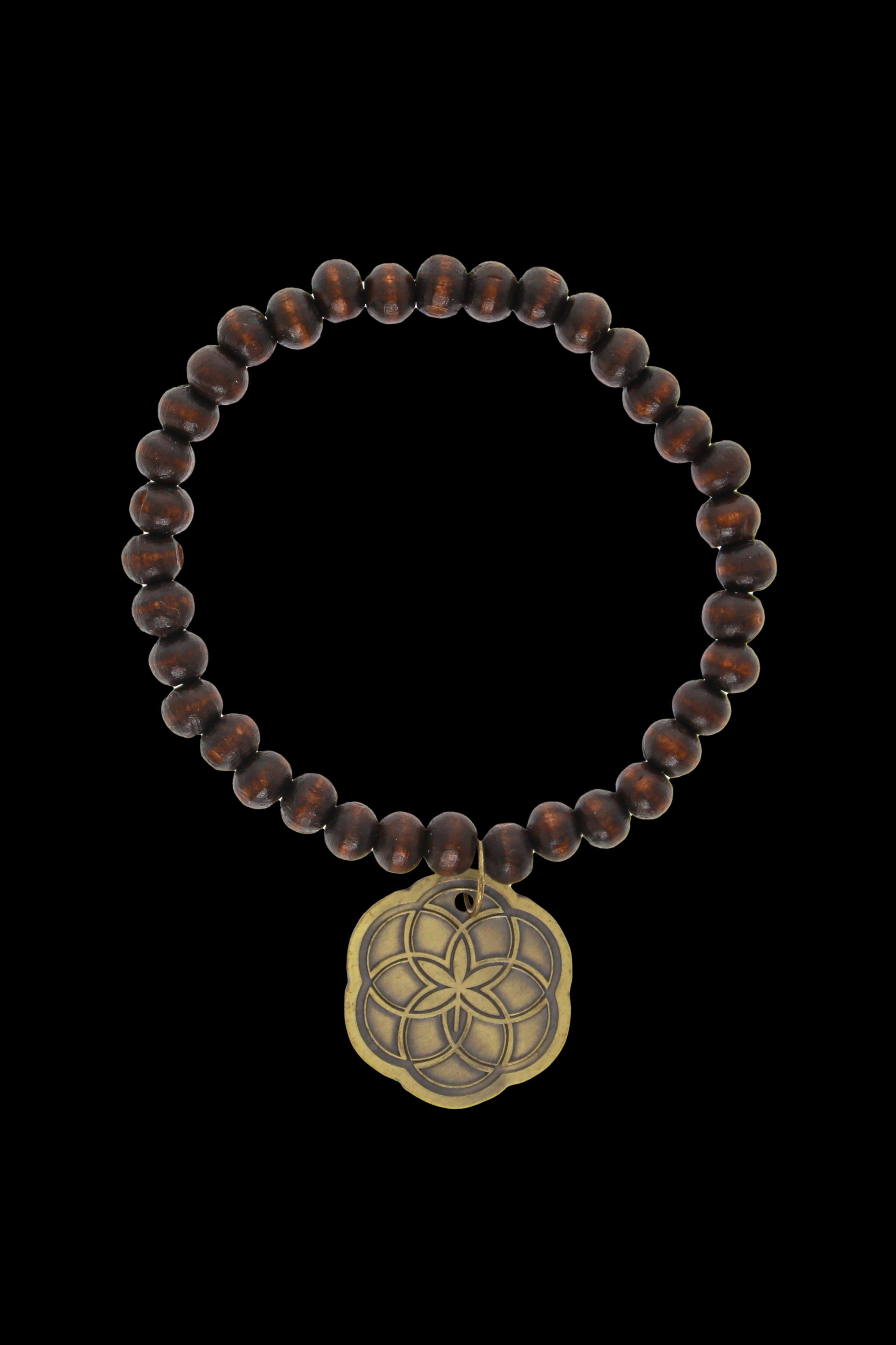 Brown beaded bracelet with a gold-toned flower of life pendant.
