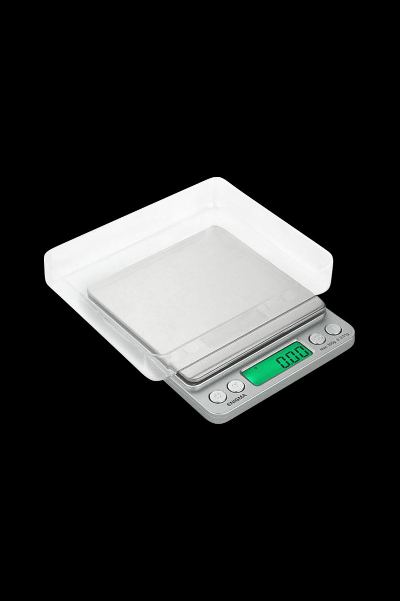 A close-up, top-down view of the Truweigh Enigma Digital Mini Scale, displaying a digital readout on its silver surface.