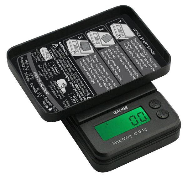 Angled view of the Truweigh Gauge Digital Mini Scale - 600g x 0.1g with its flip cover propped open revealing a green backlit LCD and printed quick-start guide inside.