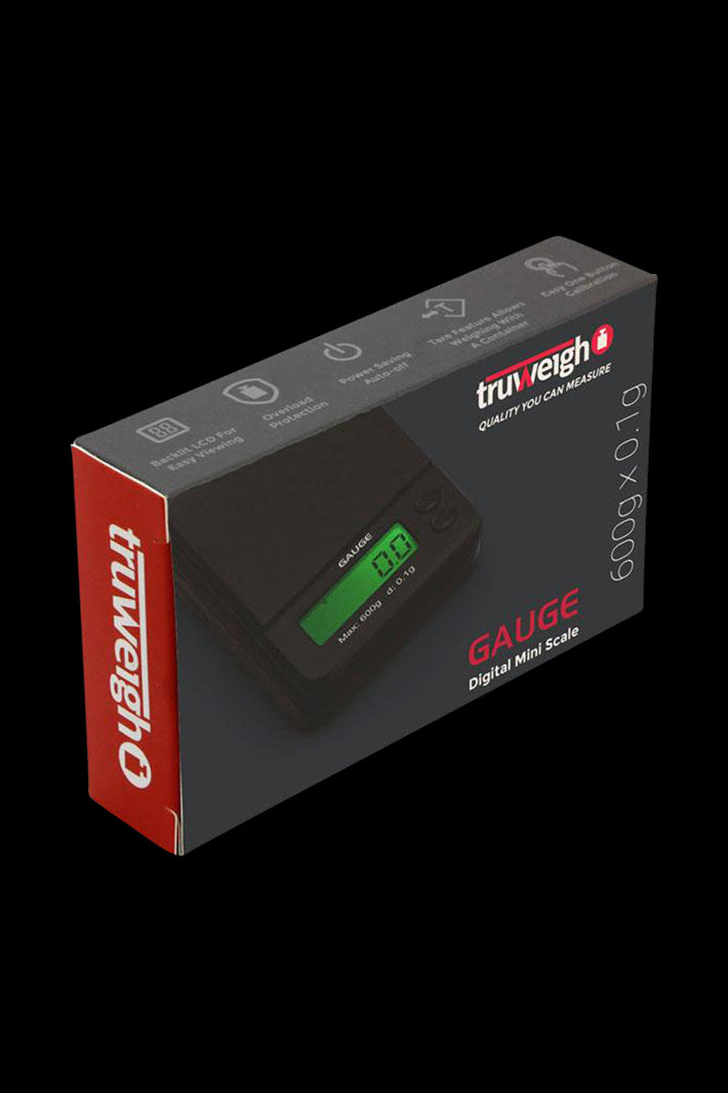 Angled three-quarter view of the Truweigh Gauge Digital Mini Scale - 600g x 0.1g boxed in gray with a red side panel and a green-lit LCD image on the packaging