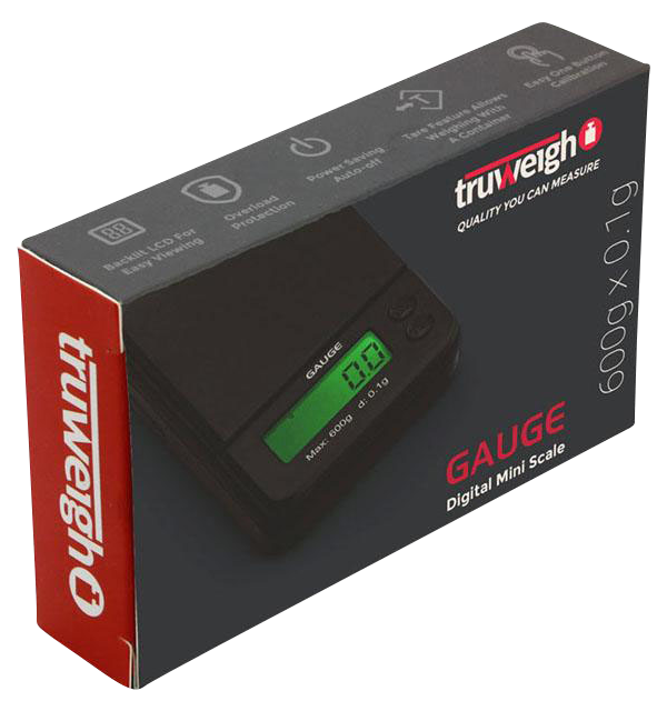 Angled pack shot of the Truweigh Gauge Digital Mini Scale - 600g x 0.1g box showing the black scale with green backlit display on a dark gray and red branded package.