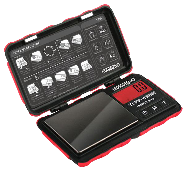 A top-down view of the open Truweigh Tuff-Weigh Mini Scale, displaying its internal components and instructional guide.