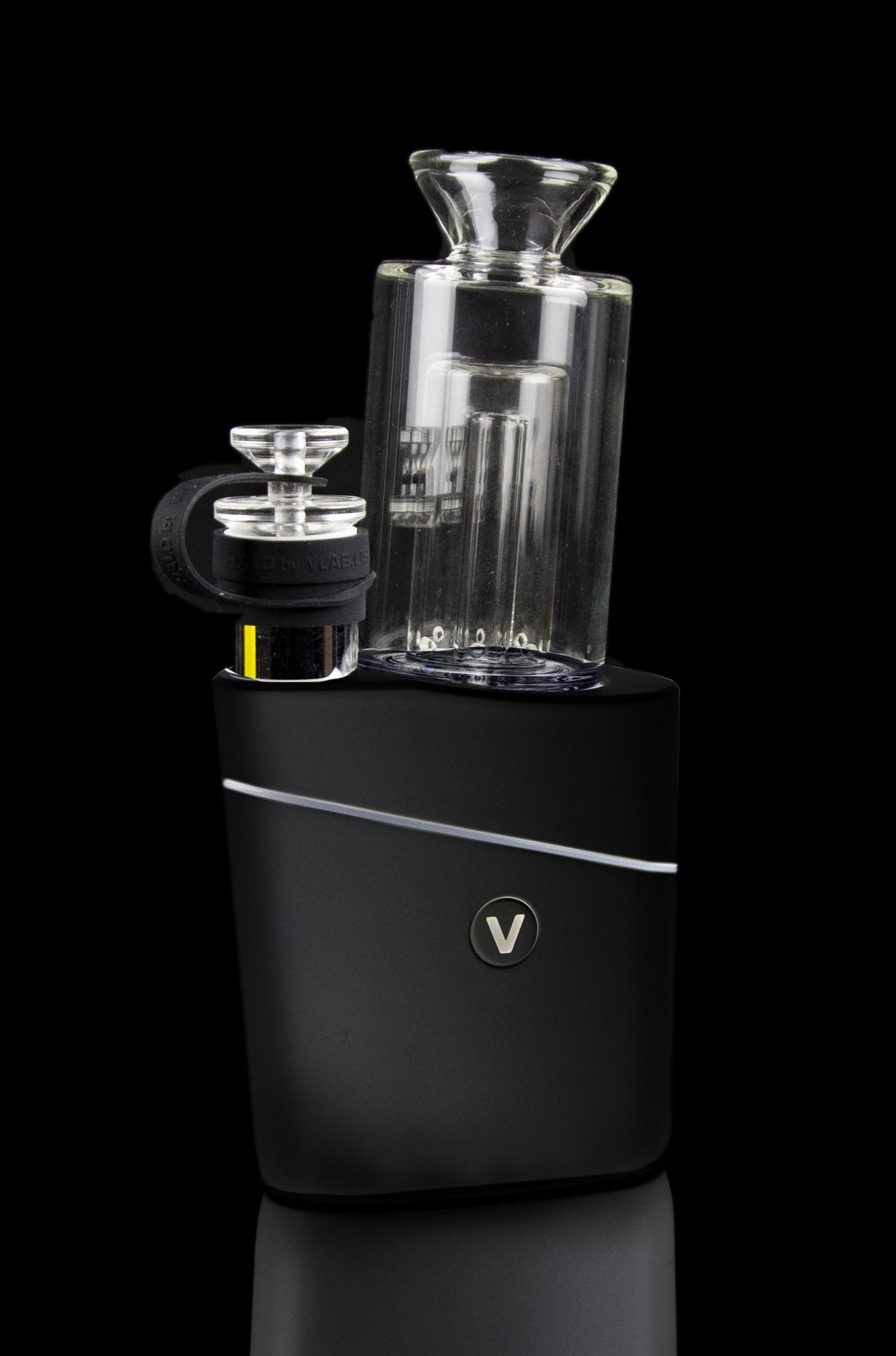 Black cannabis vaporizer with a glass bubbler attachment.