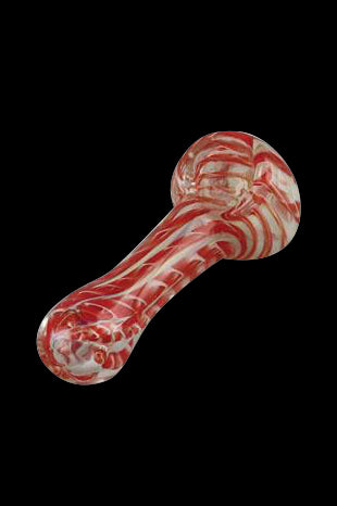 Red and white swirled glass pipe against a black background.
