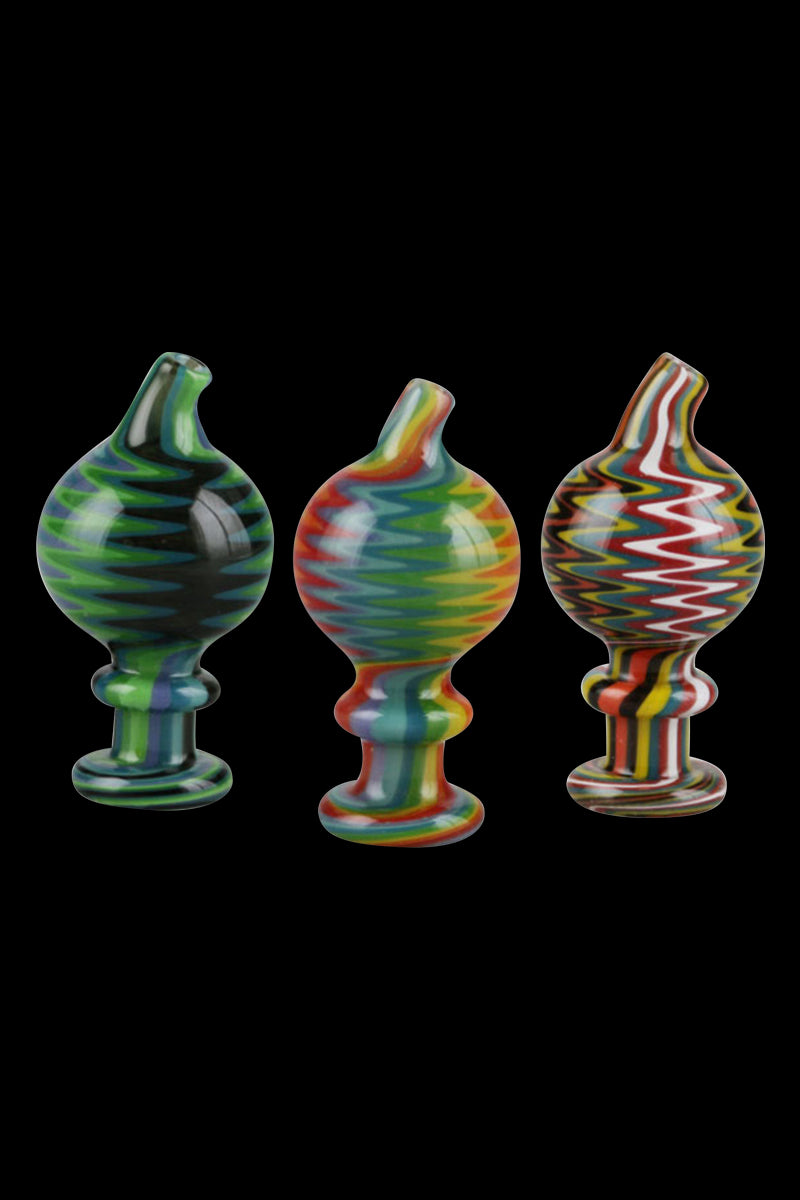 A straight-on view of the Trippy Worked Glass Carb Cap, showcasing its colorful, swirled glass design against a black background.