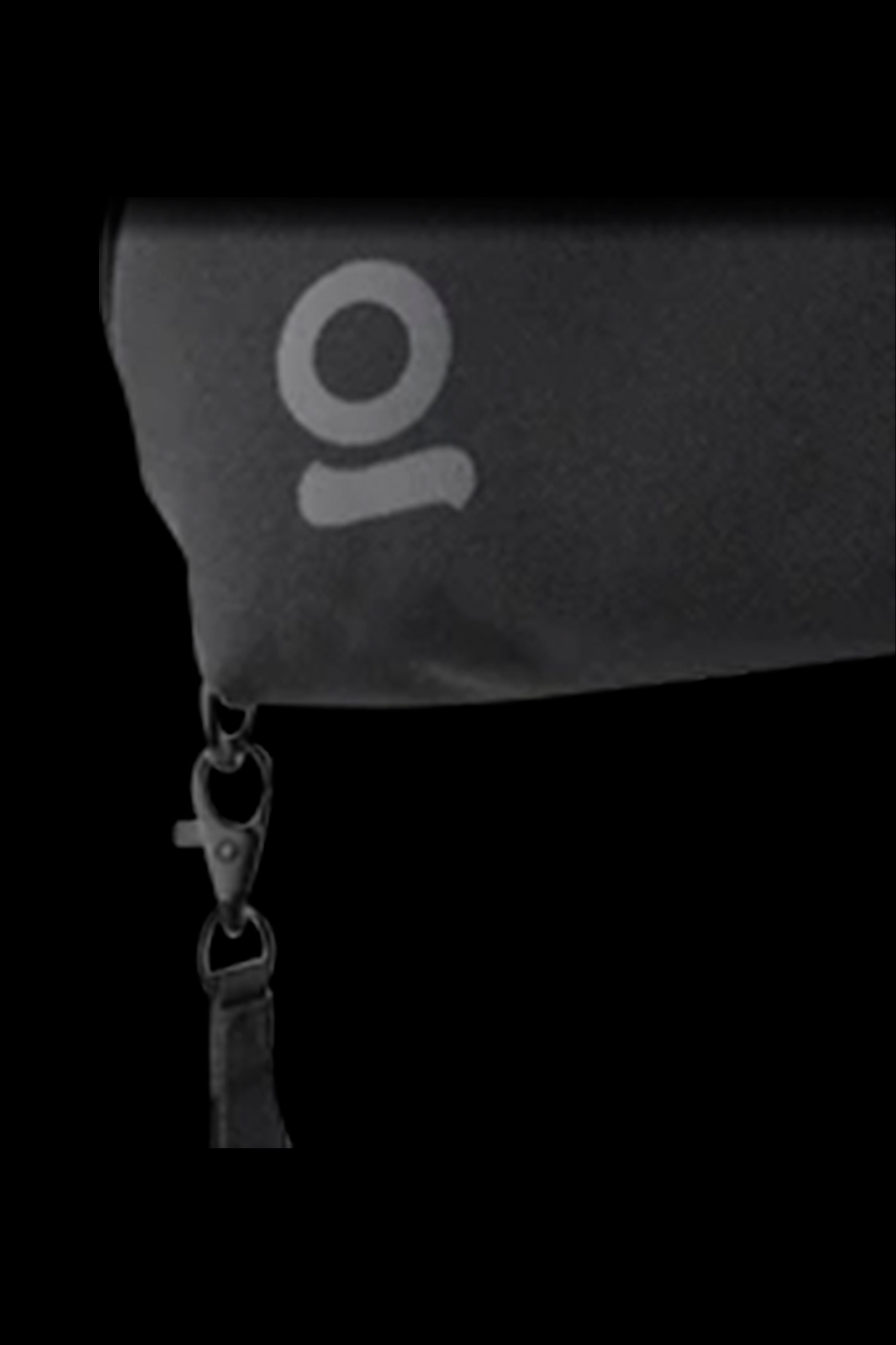 Black cannabis accessories pouch with a white "9" logo and silver chain.