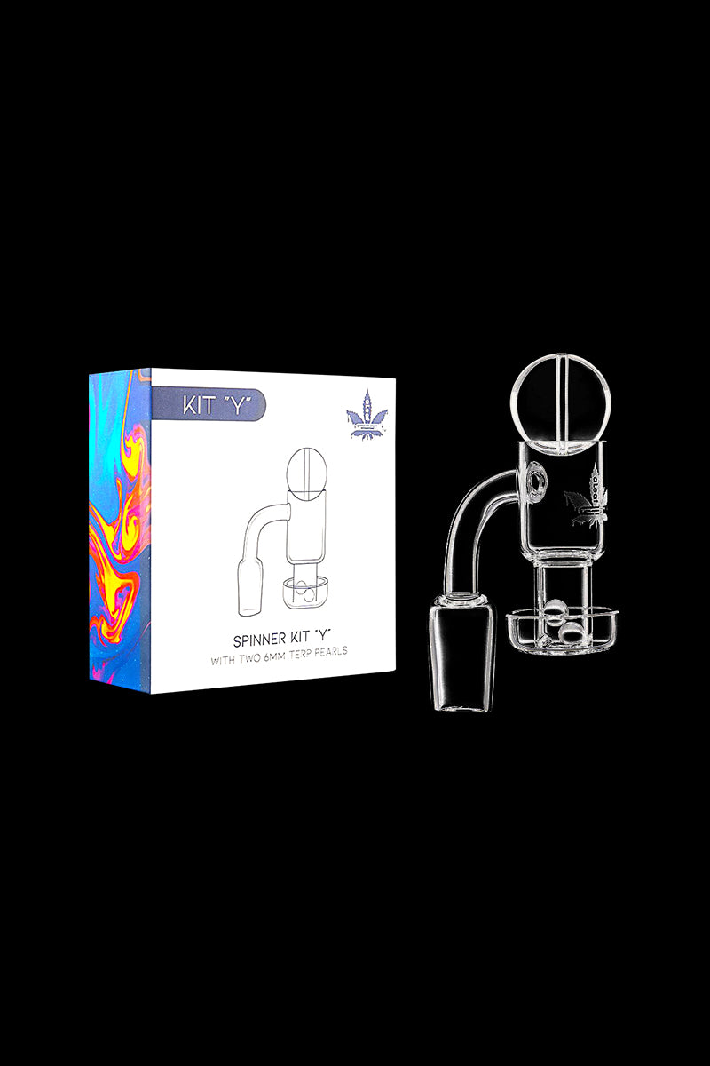 Angled product shot of the aLeaf Quartz Banger Spinner Kit -Y showing the white box with colorful side art beside the clear glass spinner component on a black background