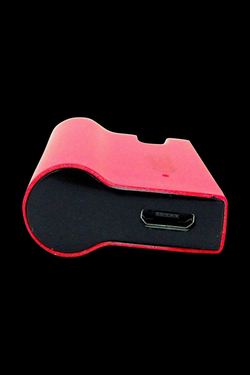 Close-up front view of the red Airis J Salt & E Juice Vaporizer showing its rounded end and visible micro-USB port against a black background