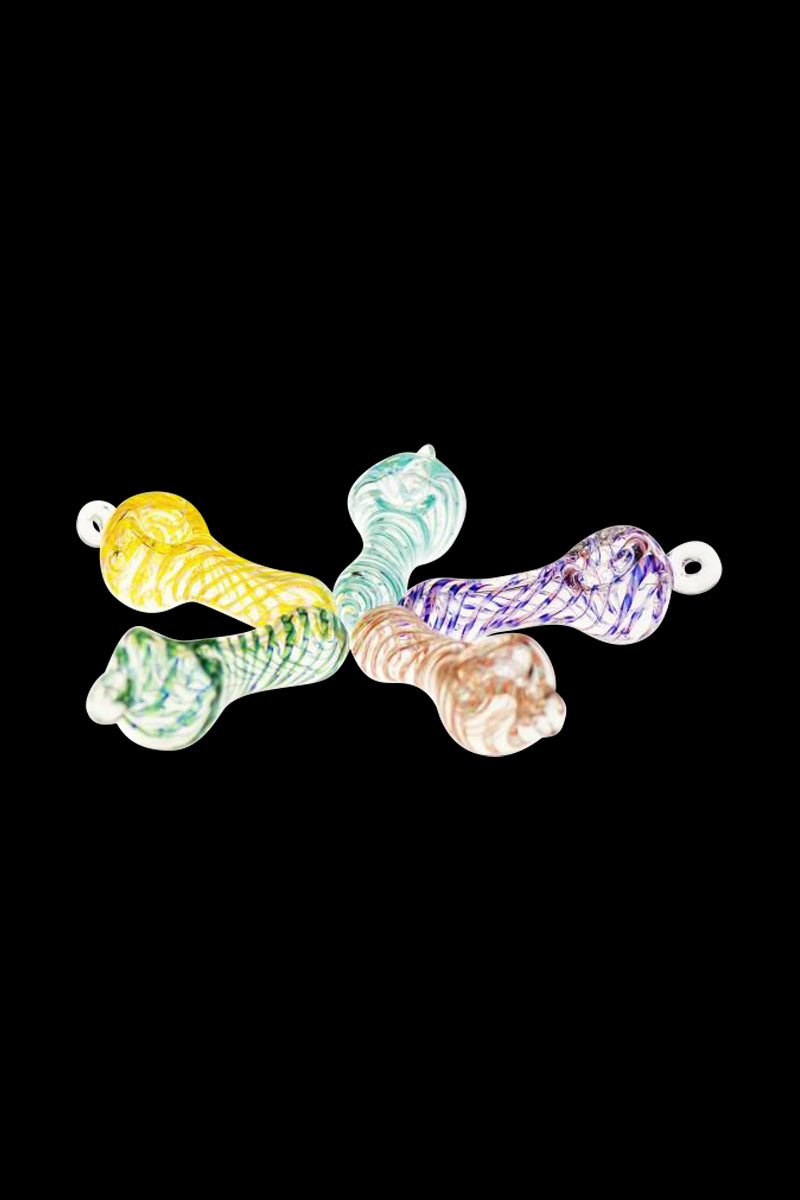 Top-down view of five colorful Spiral Beast Pendant Spoon Pipe pieces fanned out on a black background, each with swirled blue, yellow, green, purple, and pink glass patterns.