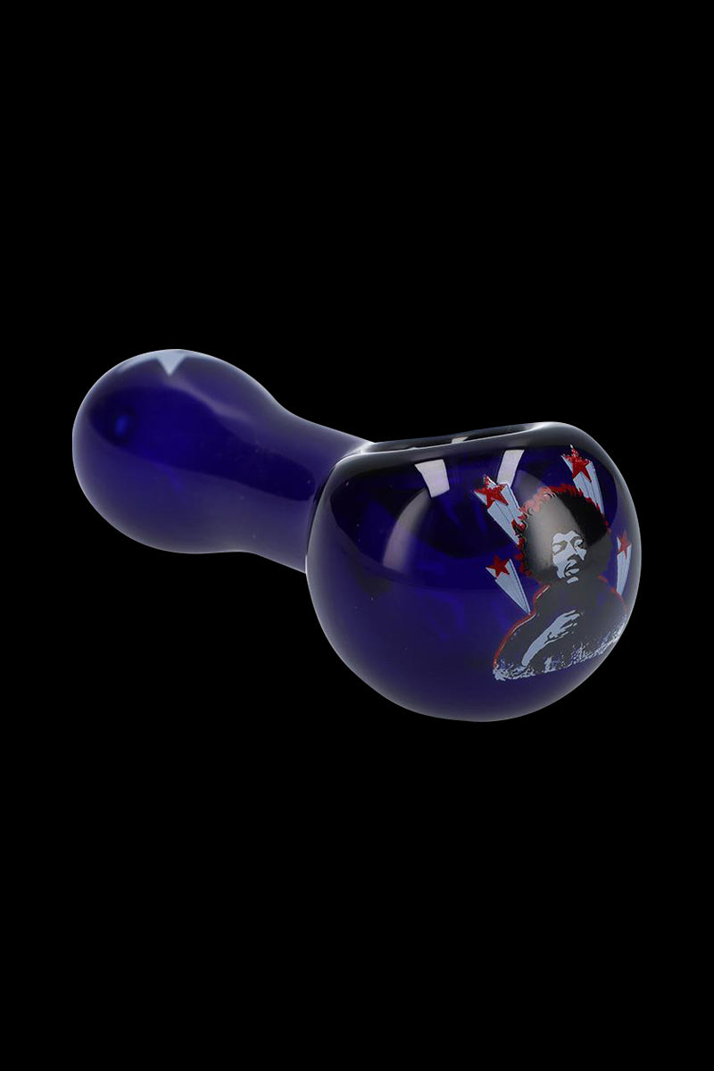 Angled view of the Rock Legends "Jimi Star" Glass Spoon Pipe in deep cobalt blue with a Jimi Hendrix portrait and red stars on the bowl