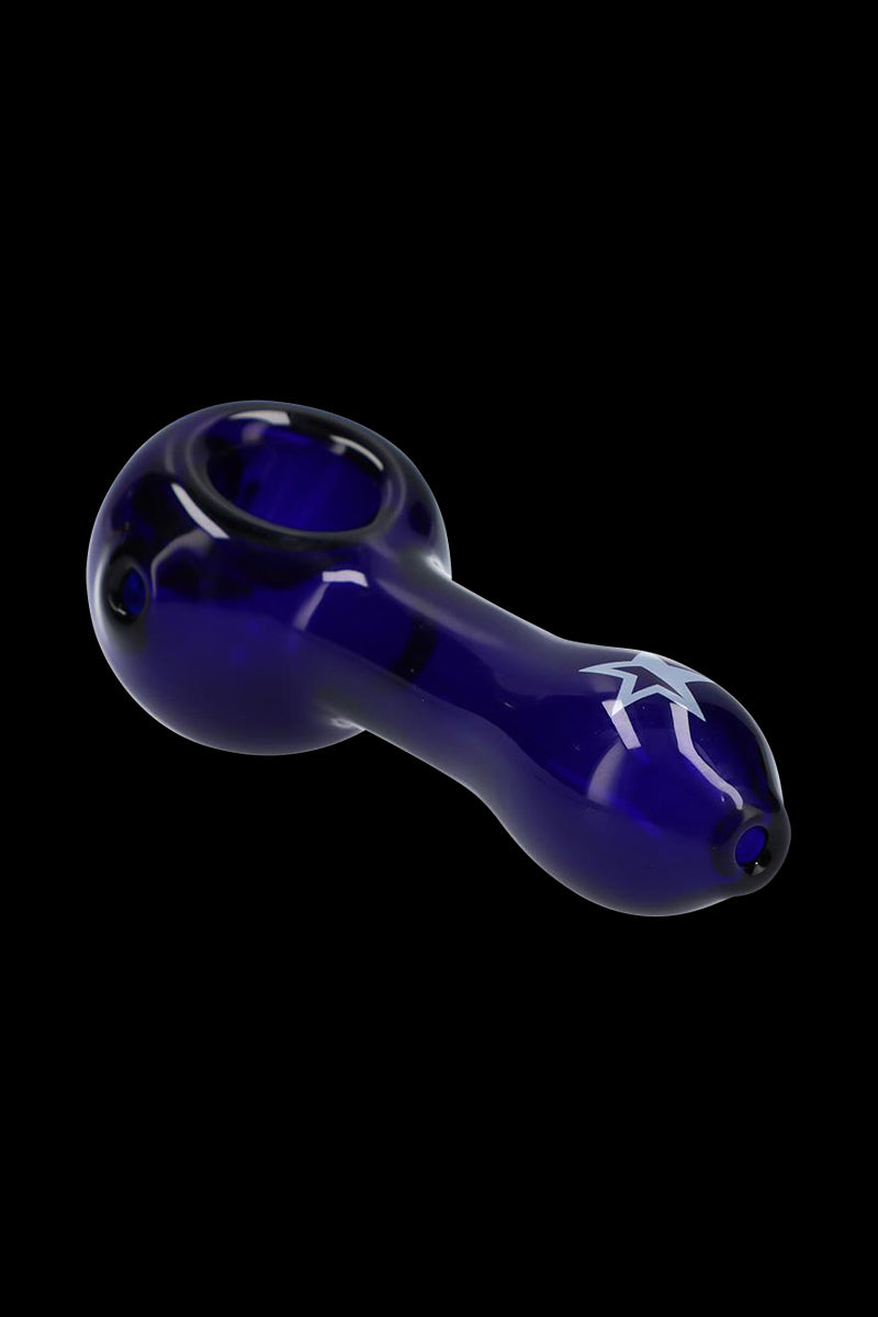Angled close-up of the deep blue Rock Legends "Jimi Star" Glass Spoon Pipe showing its rounded bowl, tapered stem, and white star decal against a black background