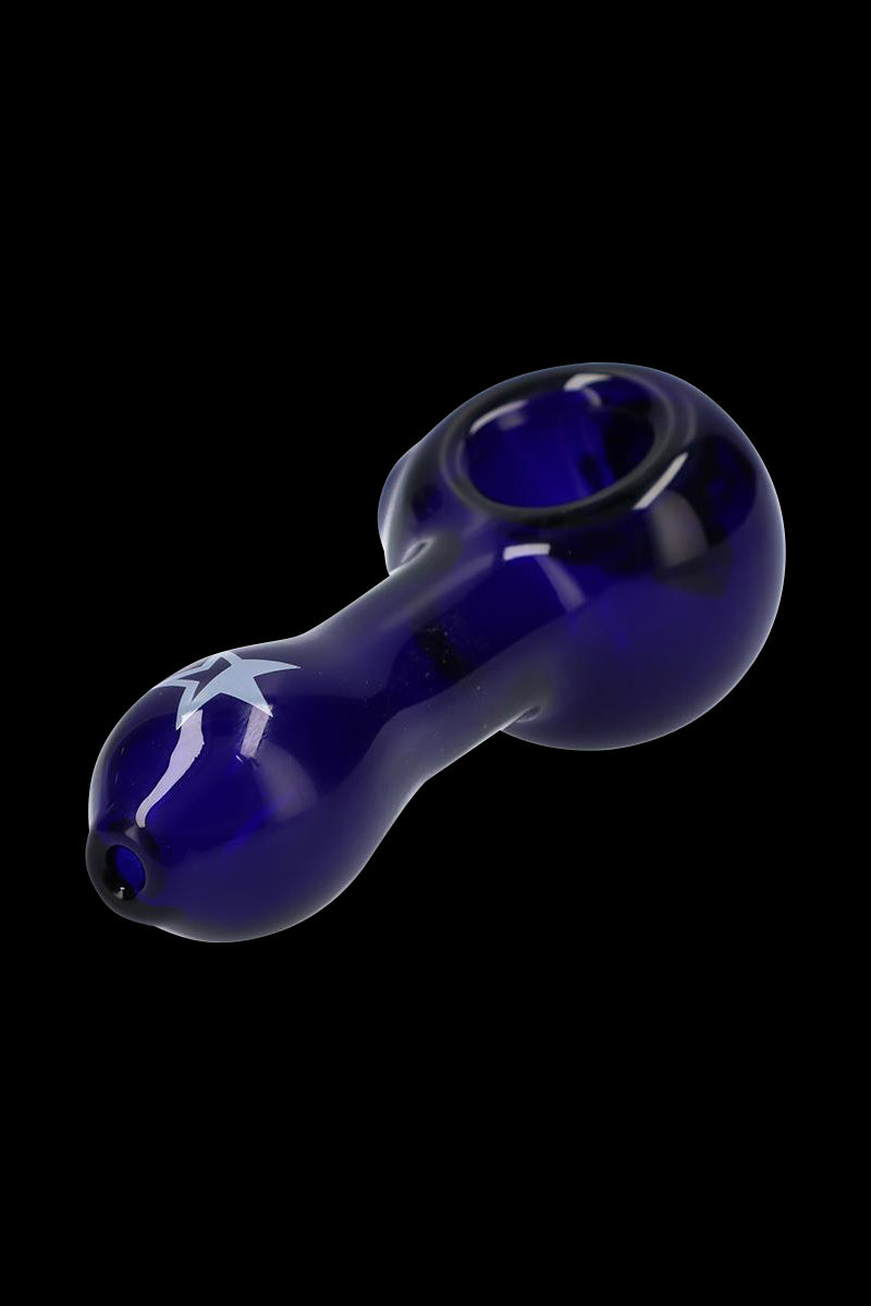 Angled close-up of the deep blue Rock Legends "Jimi Star" Glass Spoon Pipe with a white star motif against a black background