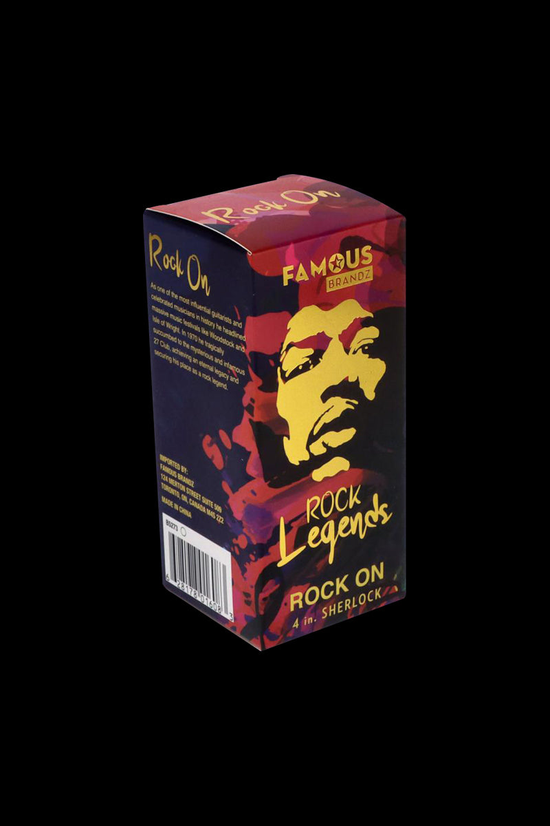 Angled front view of the Rock Legends Glass Sherlock Pipe - Jimi Rock On box with bold yellow portrait art and "Rock Legends" text on a dark background