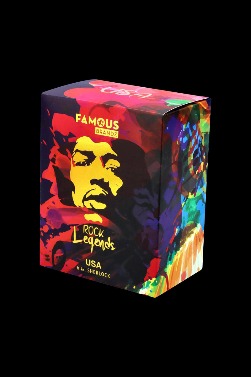 Three-quarter view of the colorful Rock Legends Sherlock Hammer Pipe - Jimi USA box with a pop-art portrait and swirling paint motifs on a black background