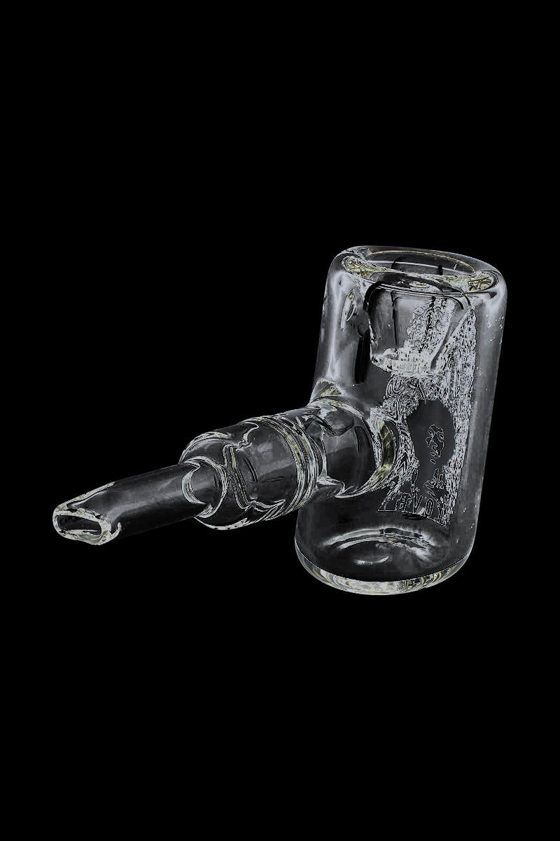 Angled close-up of the clear Rock Legends "Jimi Love" Sherlock Hammer Pipe resting on a black background, showing its tubular mouthpiece and rounded chamber.