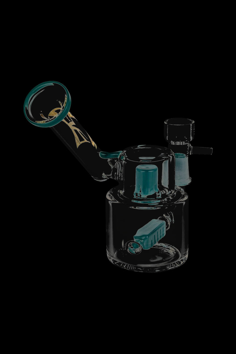 A studio shot of the Evolution Morning Glory Sidecar Dab Rig, showcasing its curved form and clear glass construction from a low angle.