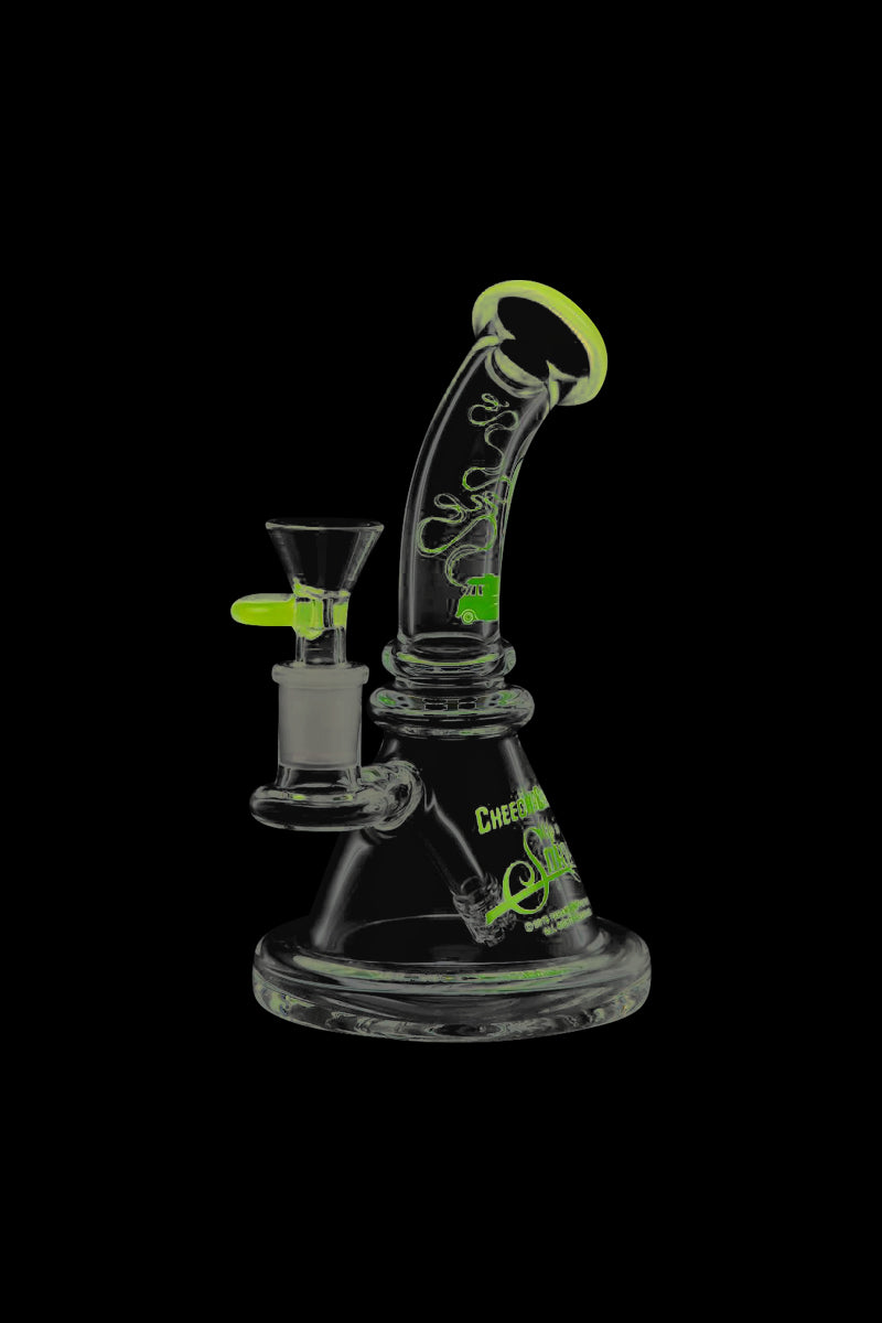 Front view of the Cheech & Chong Strawberry Mini Beaker Bong, a small, clear glass bong against a black background.