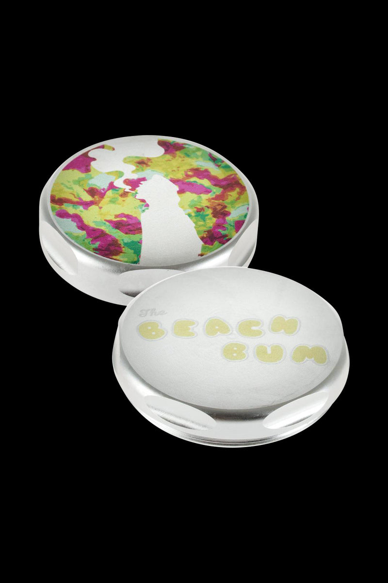 Overhead view of the Beach Bum Magnetic Aluminum Grinder - Moondog, showing its circular shape and metallic finish.