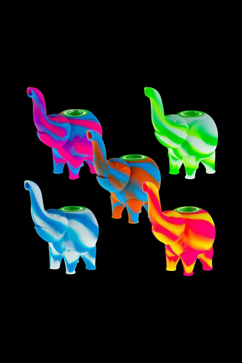 A brightly lit, angled view of the Silicone Elephant Hand Pipe, showing three colorful, miniature elephant-shaped pipes against a black backdrop.