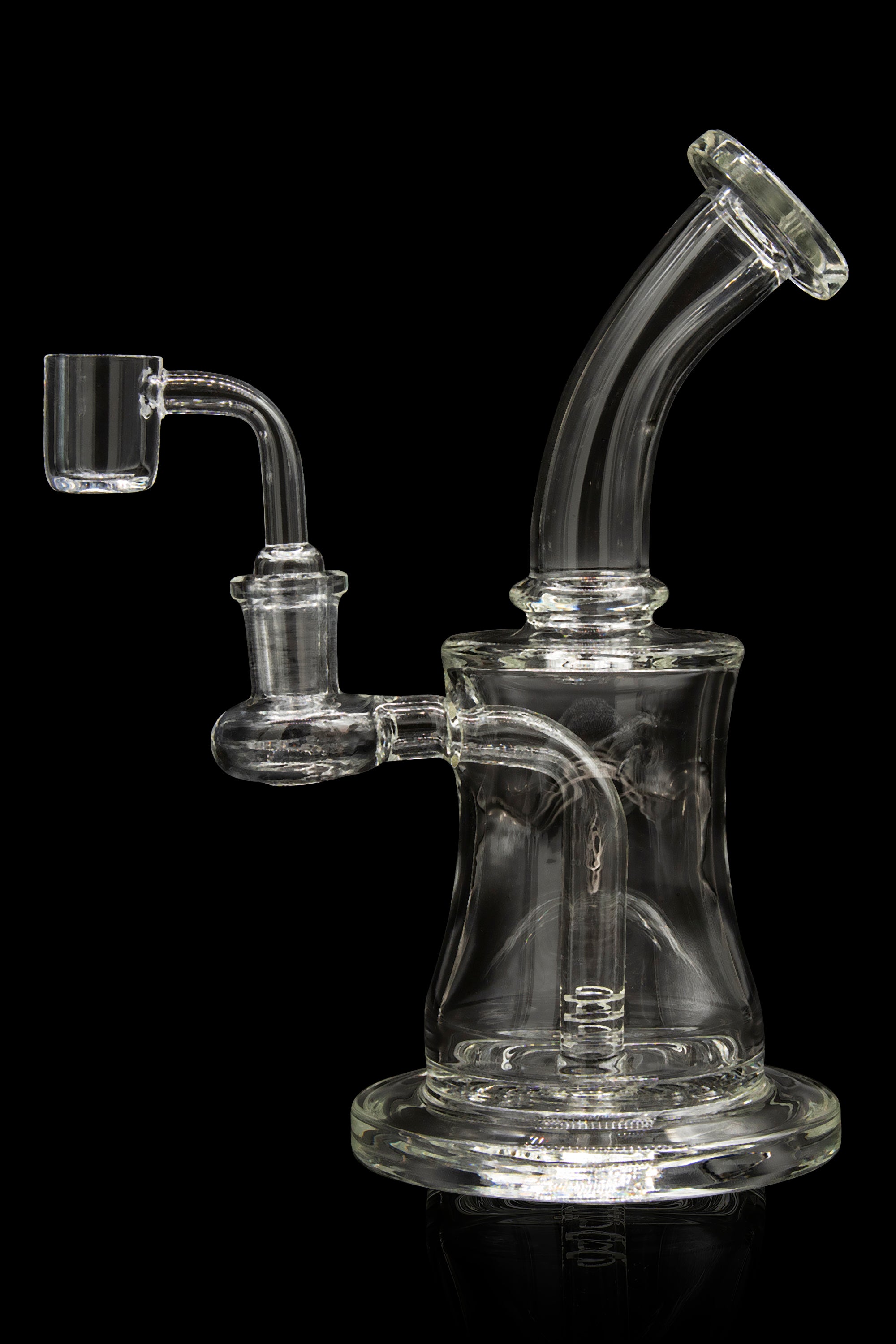 Clear glass dab rig with quartz banger, against a black background.