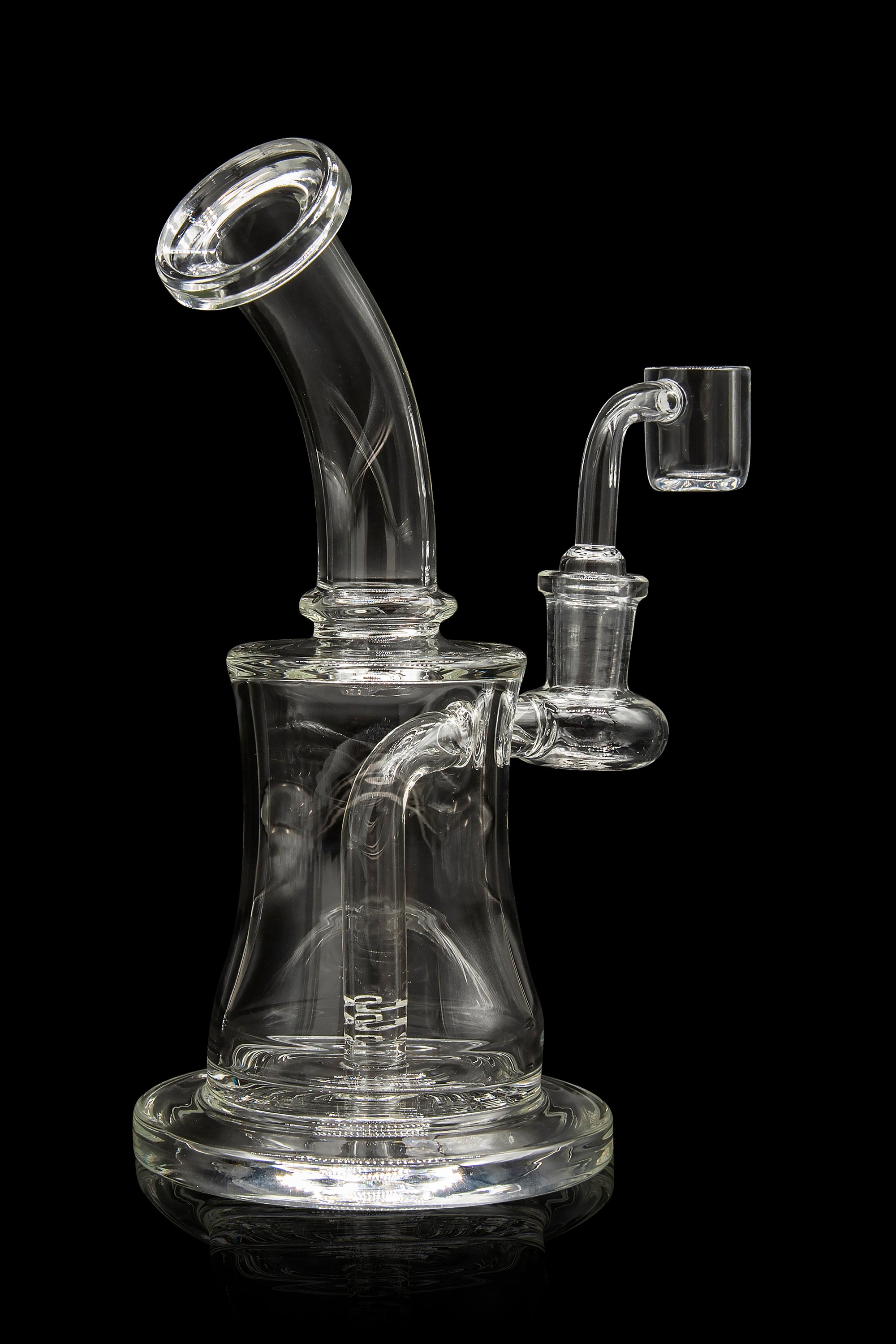 Clear glass dab rig with a bent neck and quartz banger, isolated on a black background.