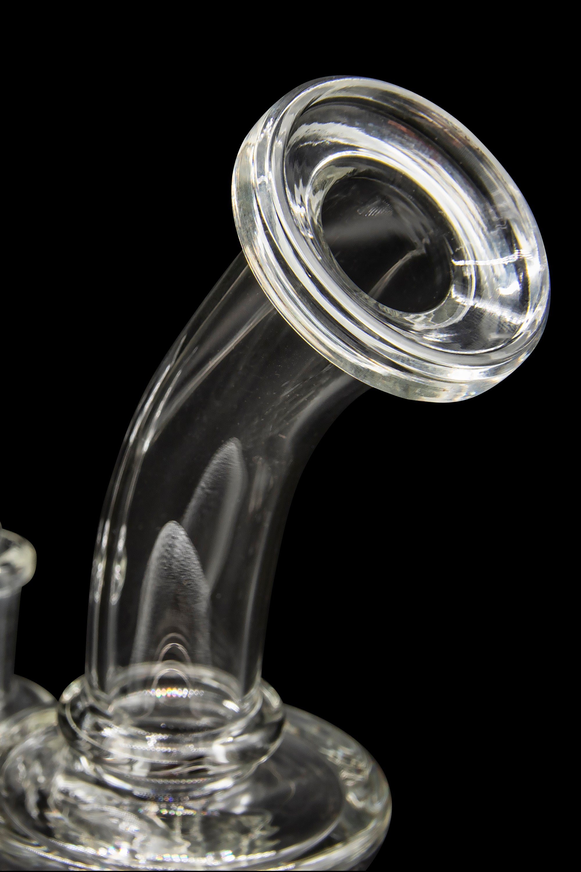 Clear glass bubbler or water pipe against a black background.