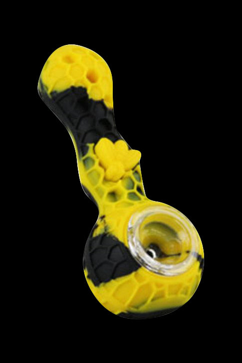 Angled top-down view of the Silicone Bee Durable Hand Pipe showing its yellow-and-black honeycomb silicone body with a small bee accent and glass bowl.