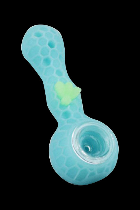 Top-down view of a turquoise Silicone Bee Durable Hand Pipe with honeycomb texture and a small raised yellow bee accent against a black background