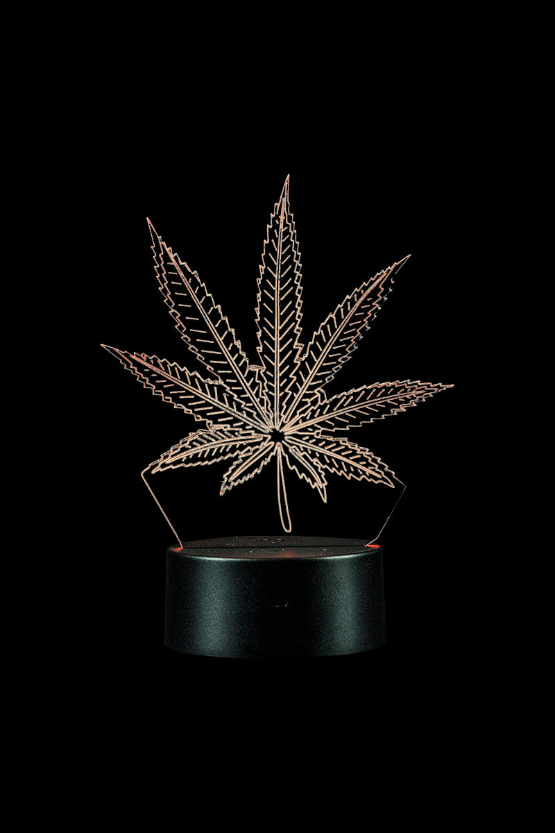 A front view of the 3D Cannabis Leaf Lamp, showcasing a detailed, illuminated leaf design against a dark backdrop.