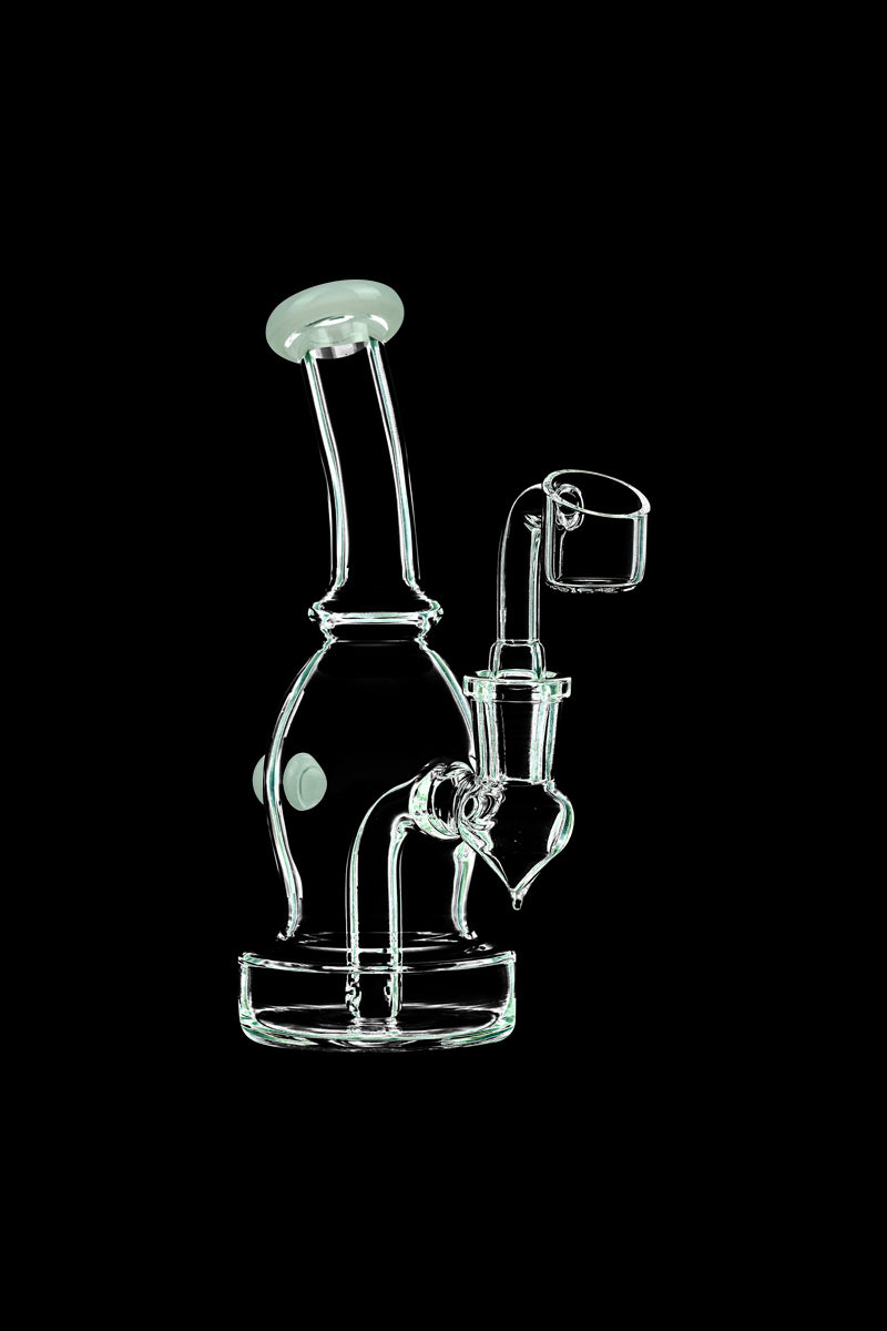 A three-quarter view of the DankStop Curved Body Dab Rig With Colored Accents, showcasing its clear glass construction and curved design.