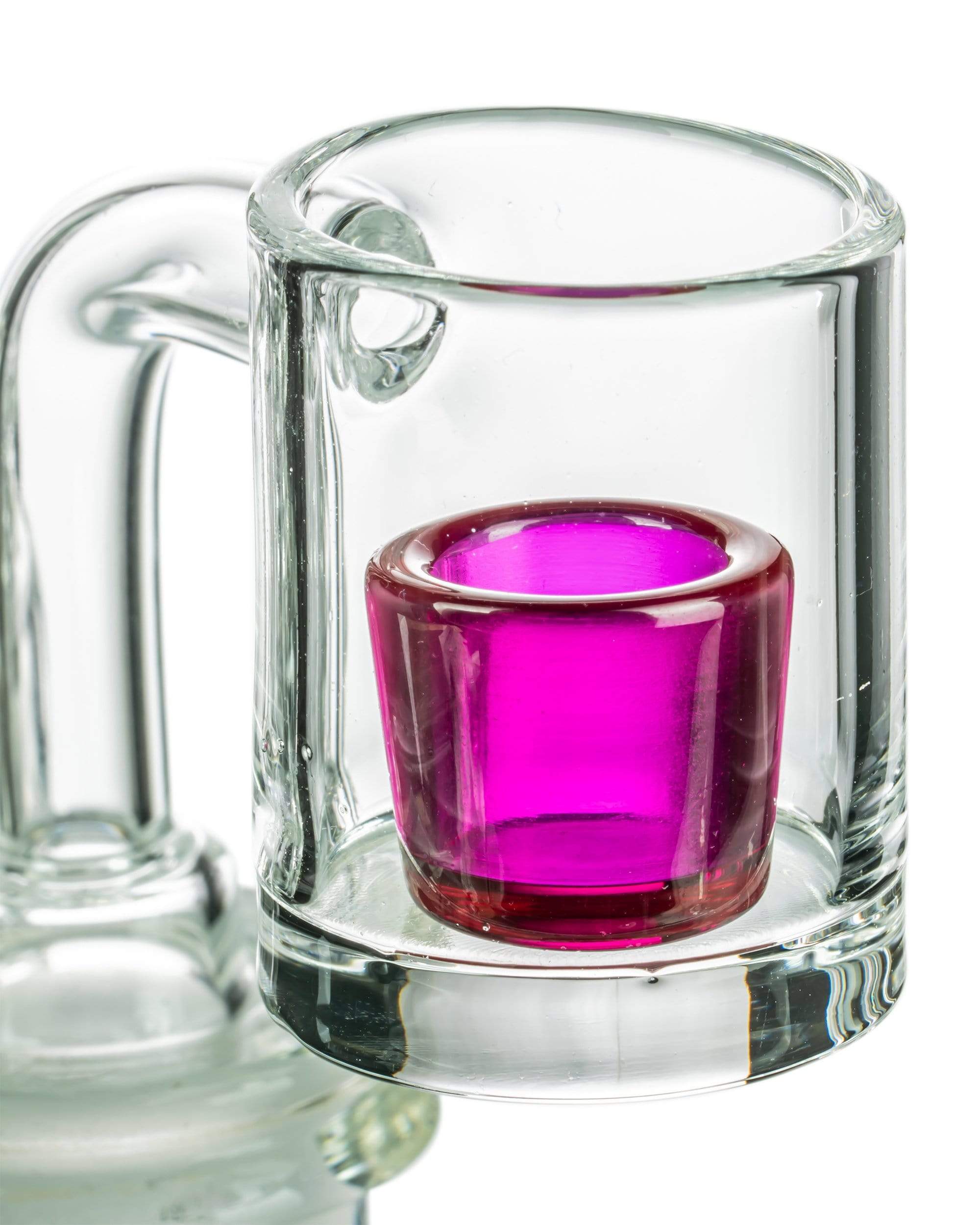 A close-up, angled view showcases the Ruby Quartz Cup Insert for E-Rig, its vibrant red color visible within a clear glass insert.