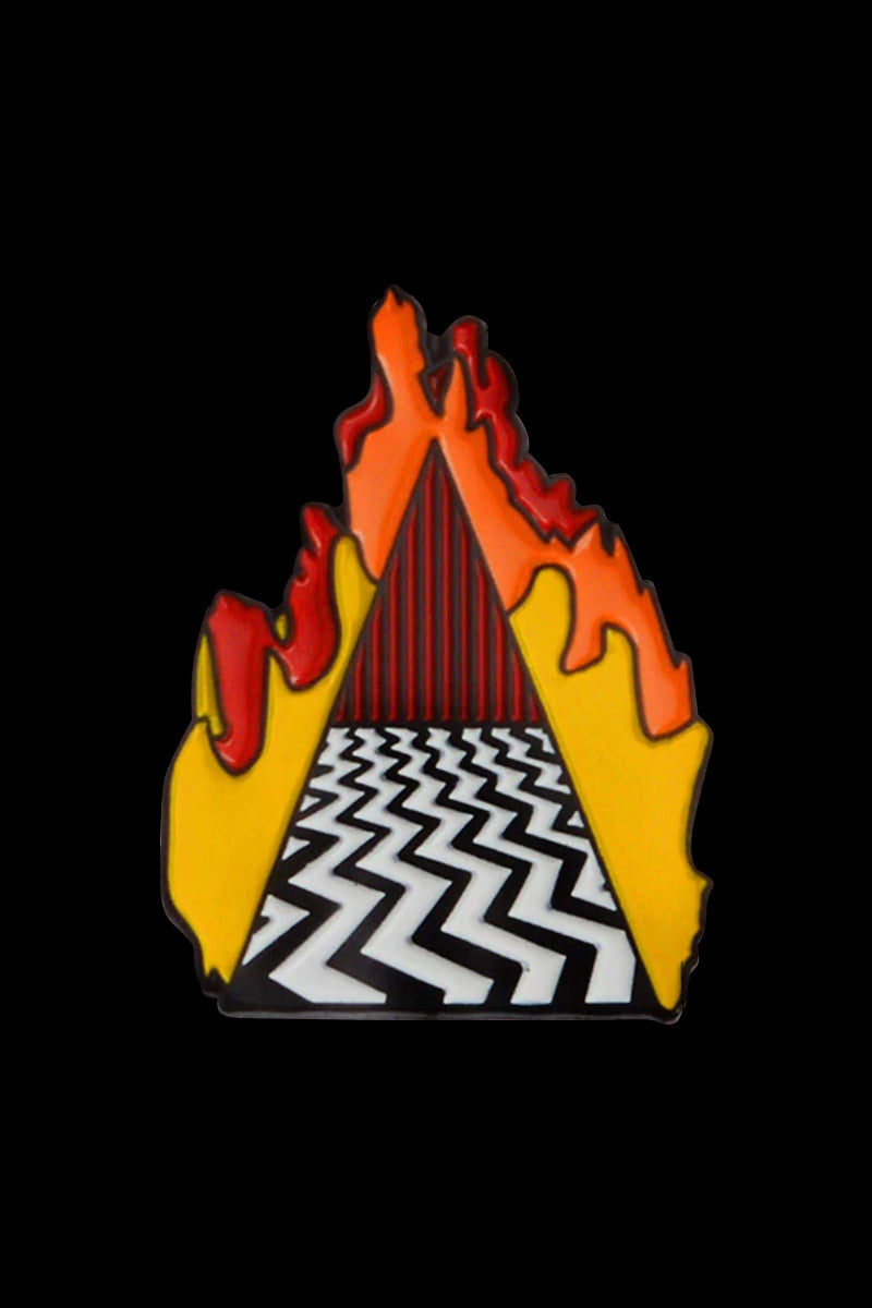 The Fire Walk Enamel Pin depicts vibrant orange and red flames surrounding a dark, shadowed figure, rendered in a glossy, illustrative style.
