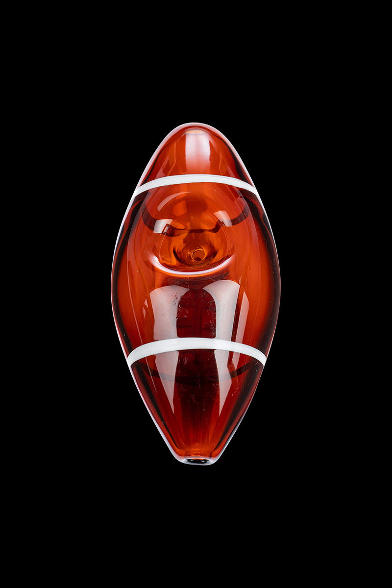 Top-down view of a glossy amber Football Hand Pipe with two white stripes centered on a black background.