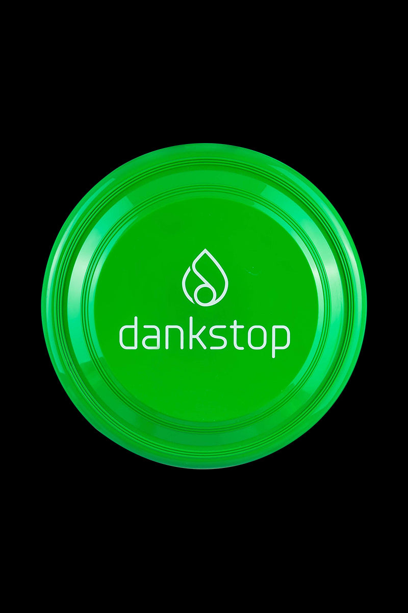 Frisbee disc captured in a clean, top-down studio shot against a stark black background.