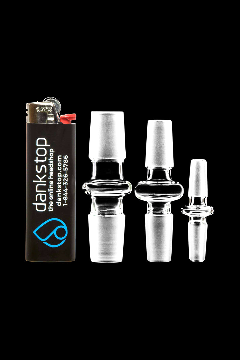 A slightly angled close-up of the Male to Male Glass Adapter, showcasing its clear glass construction against a dark background.