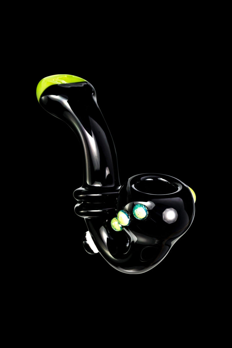 Angled studio close-up of the Maria Ring Sherlock Pipe in glossy black with green accents against a black background.