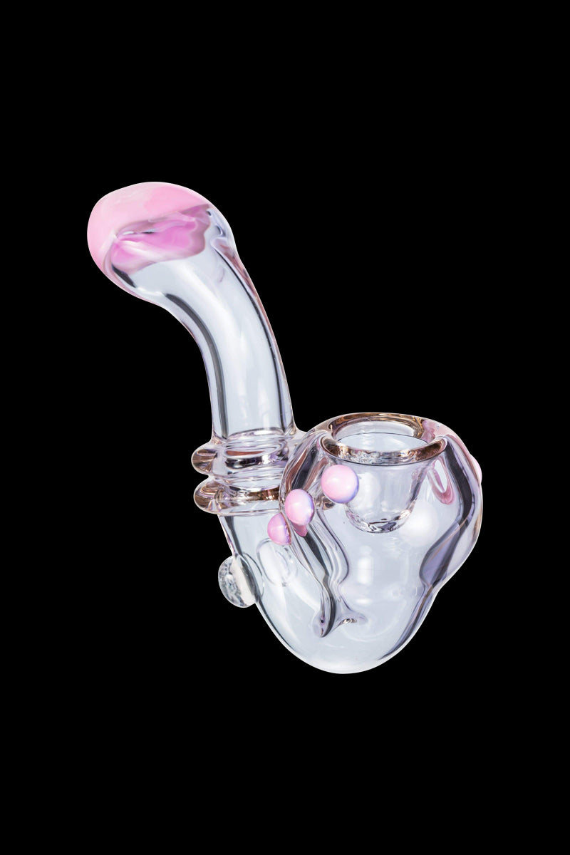 Angled close-up of the Maria Ring Sherlock Pipe showing its clear glass body with pink accents and a bulbous bowl against black.