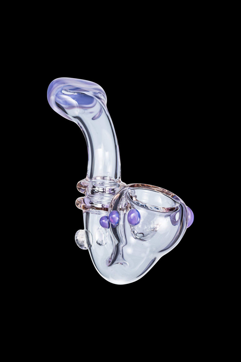 Three-quarter view of the Maria Ring Sherlock Pipe against a black background, showing its clear glass body with teal-tinted purple accents and rounded bowl.