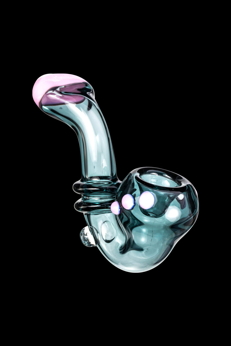 Angled side view of the teal Maria Ring Sherlock Pipe with a curved neck, pink mouthpiece tip, and three pink accent dots on a black background