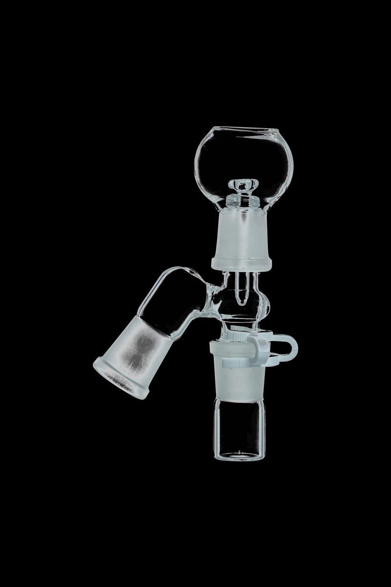 Center-lit close-up of a clear glass Reclaim Catcher showing its 45° angled male joint and funnel-shaped chambers against a black background