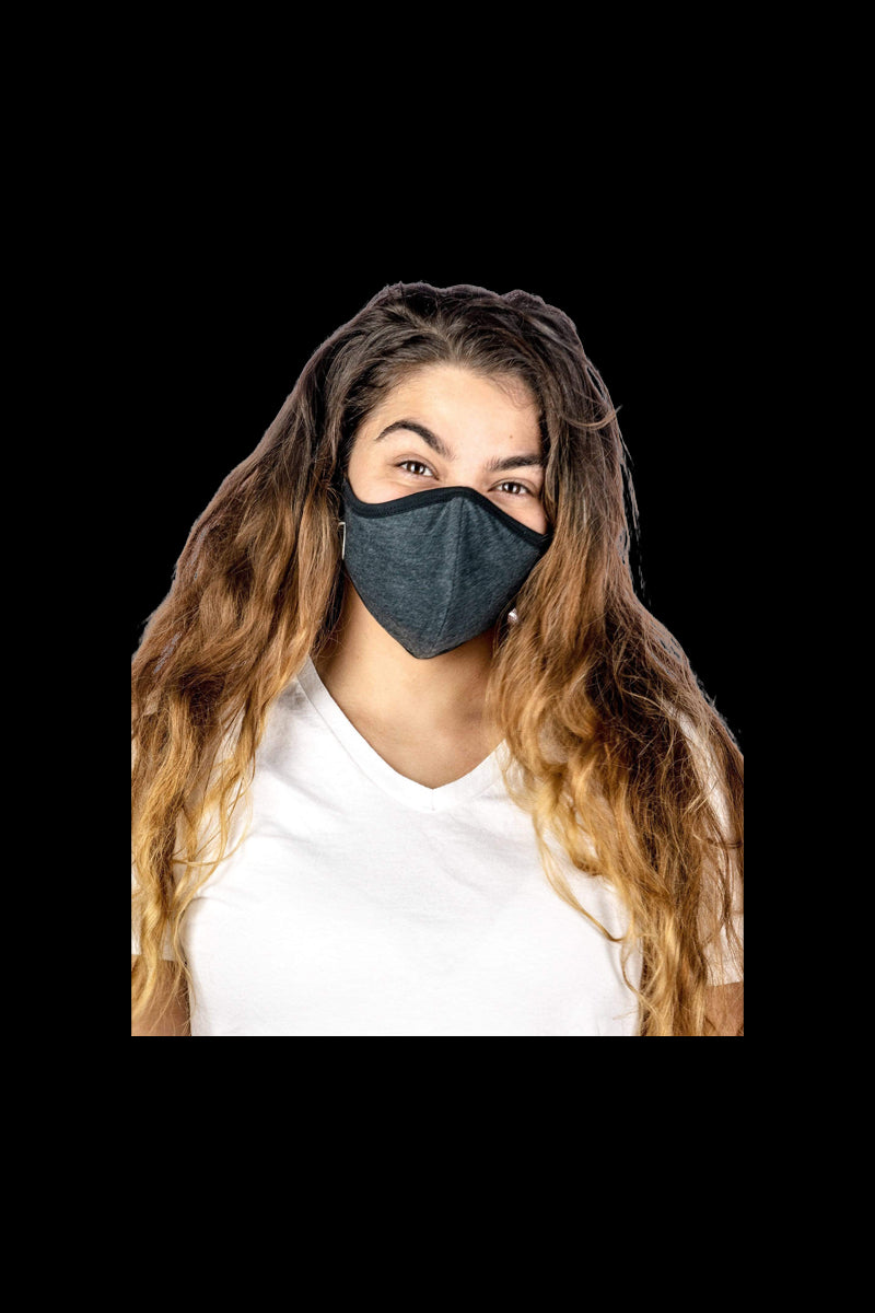 A close-up, front view of a person wearing the Reversible Cloth Mask against a plain white background.