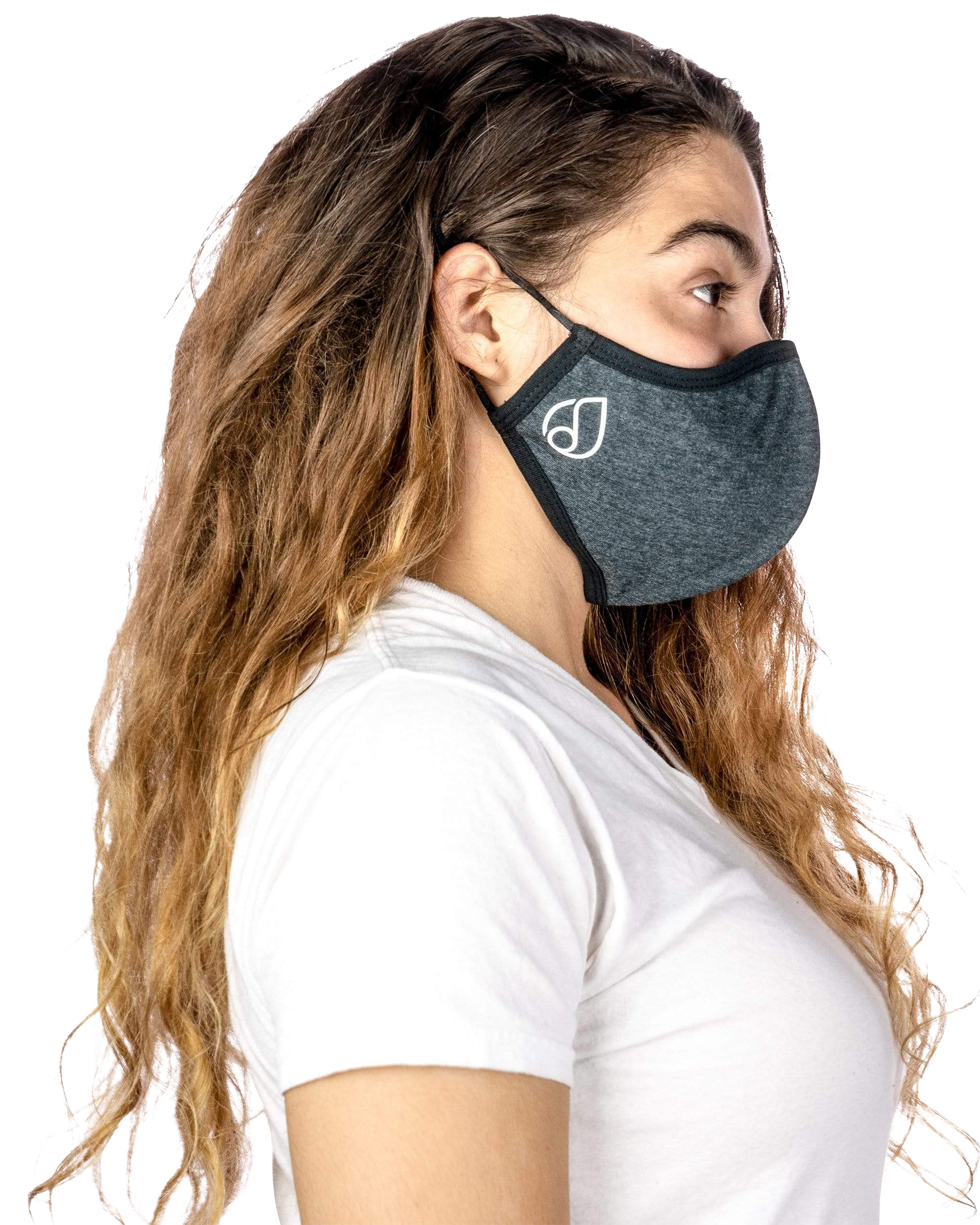 A woman wearing a Reversible Cloth Mask in a close-up, angled studio shot with soft lighting.