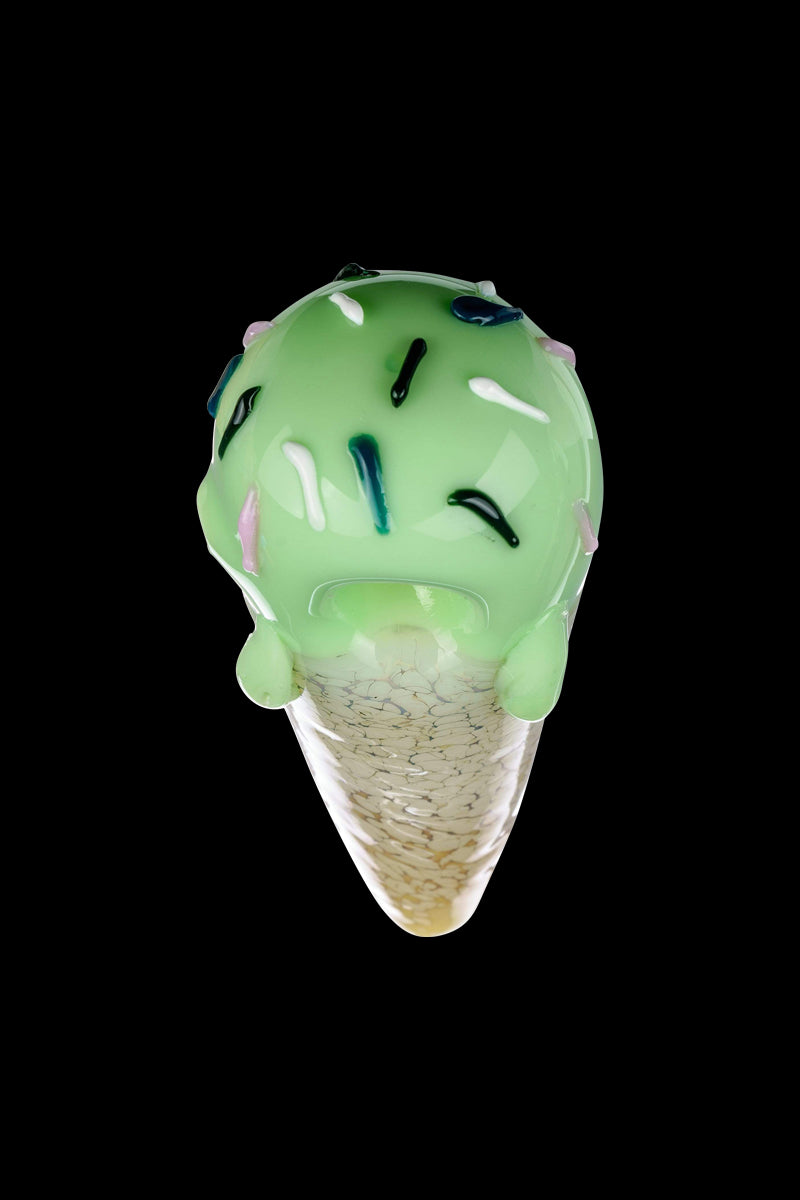 A close-up, angled view of the Single Scoop Ice Cream Spoon Pipe, resembling a swirled ice cream cone in shades of green and amber.